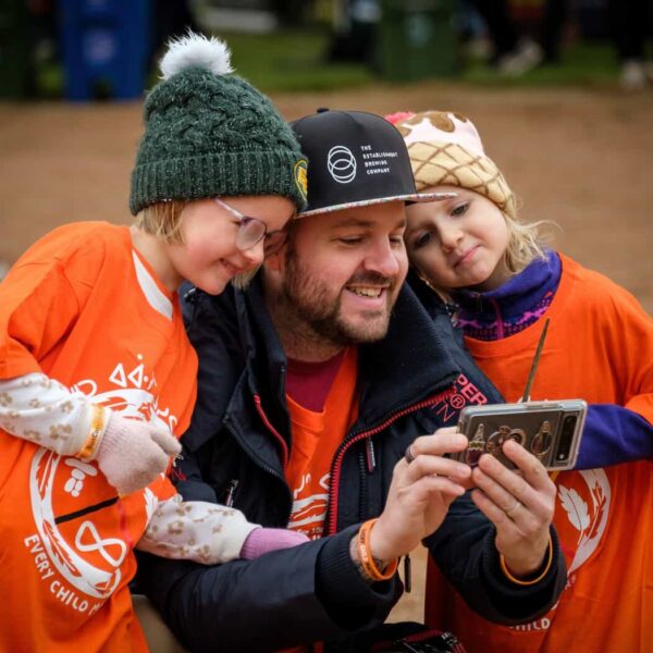 Father and kids at Orange Shirt Day 2023